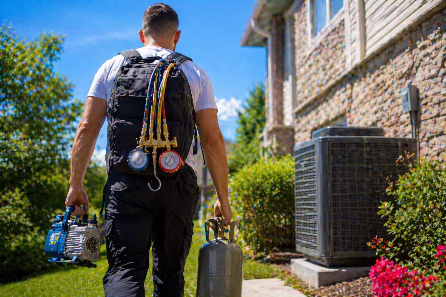 HVAC technician walking up to a Utah home for cooling service